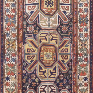 Vertical runner rug featuring a central navy field with three geometric medallions in yellow, terracotta, and cream accents.