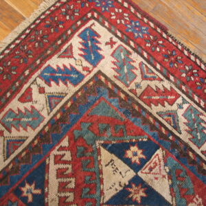 Colorful geometric patterned antique rug