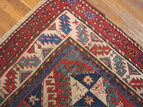 Colorful geometric patterned antique rug