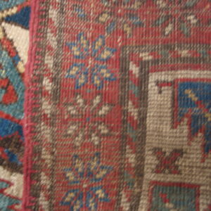 Colorful patterned vintage wool rug