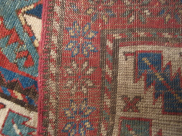 Colorful patterned vintage wool rug