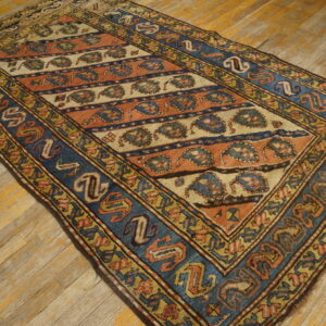 Colorful vintage Caucasian patterned rug