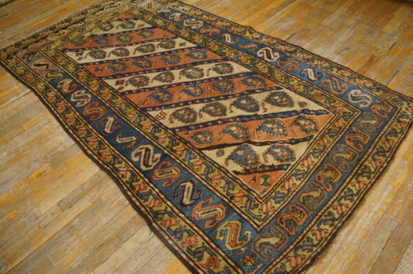Colorful vintage caucasian patterned rug