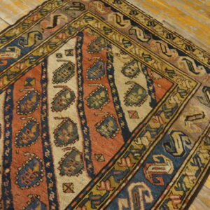 Colorful antique Caucasian knotted rug
