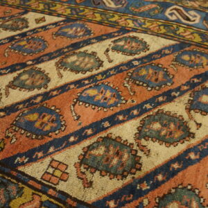 Colorful patterned antique Caucasian rug
