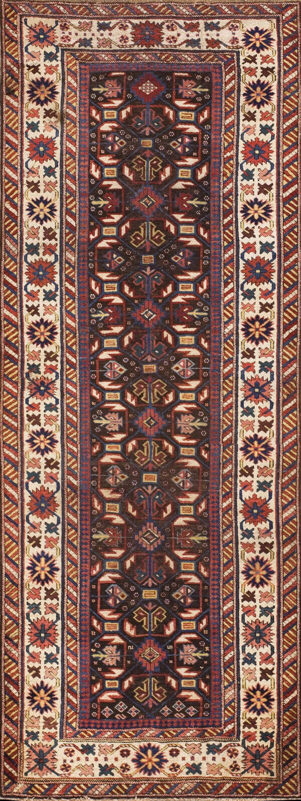 A vertical runner rug with a dark brown geometric field and a wide cream border featuring colorful star motifs.