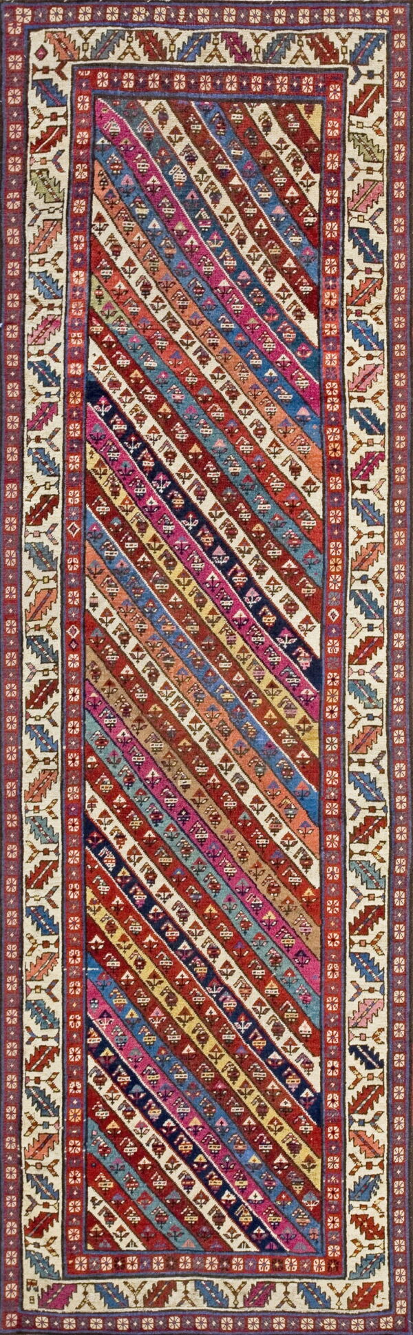 Vibrant, multicolored runner rug featuring diagonal stripes filled with geometric patterns and thick, patterned cream borders.