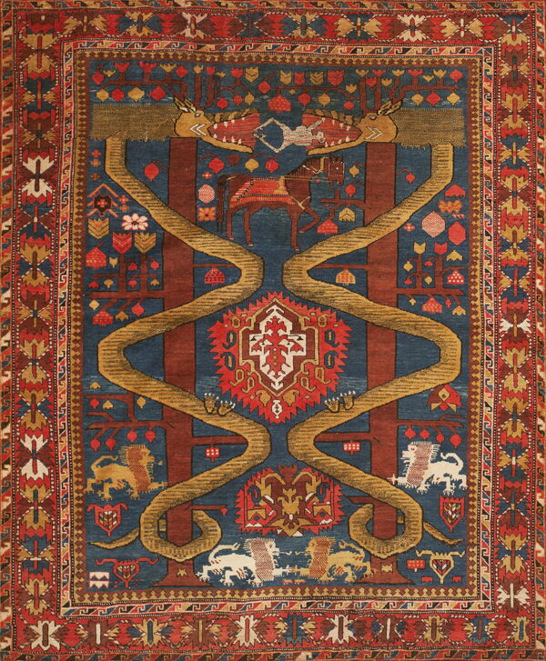 A dark blue and red patterned rug featuring stylized animals, trees, and large yellow serpentine designs.