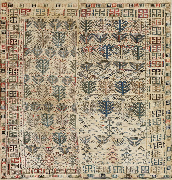 A cream rug featuring rows of stylized trees in blue, red, and brown, framed by wide geometric borders.