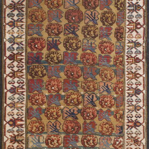Low-pile rug featuring repeating rust and blue tribal motifs on a gold field with thick cream geometric borders.