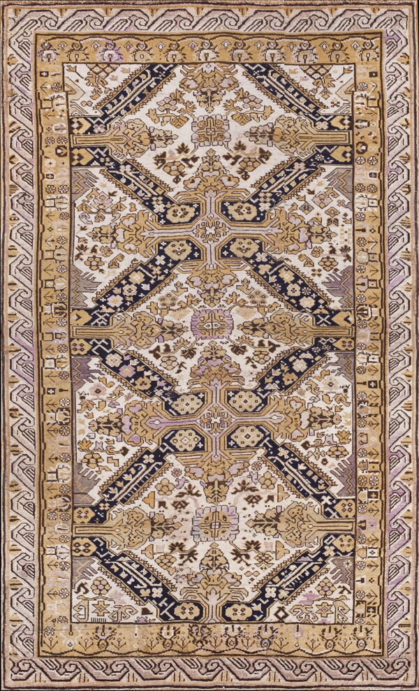 Detailed low-pile rug featuring geometric patterns in cream, khaki, navy, and muted purple tones.