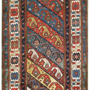 Red, blue, and cream runner rug with diagonal bands containing paisley patterns and elaborate borders.