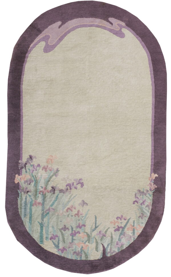 Oblong rug with a pale field, deep purple border, and stylized lavender iris flowers along the bottom edge.