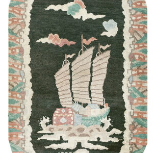 Oval dark green rug featuring a beige sailboat motif framed by an abstract rustic and mint green border.