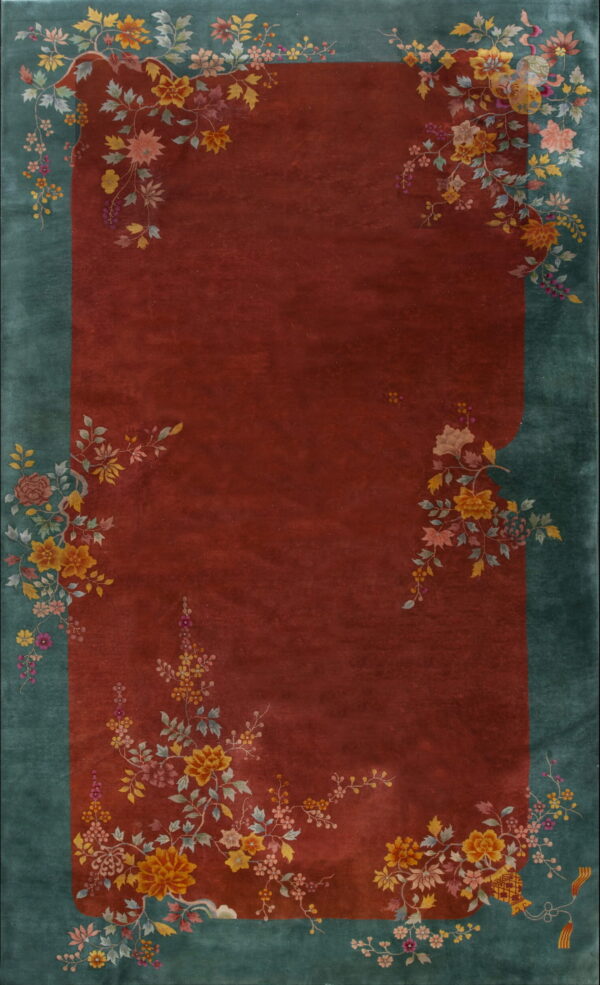 Rectangular rug featuring a reddish-brown field and a wide teal border with detailed multicolored floral patterns.