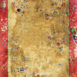 Gold rug with high sheen, thick red border, and multicolored flowering vines, birds, and lanterns.