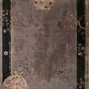 Dark gray rug with a wide black border and detailed multicolored flowers, vines, and lanterns.