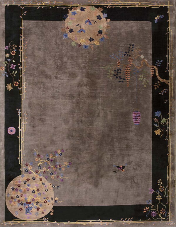 Dark gray rug with a wide black border and detailed multicolored flowers, vines, and lanterns.