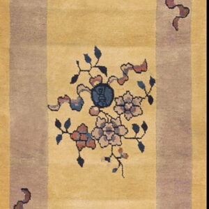 Yellow runner rug with wide purple borders and repeating floral and symbolic blue and pink motifs.