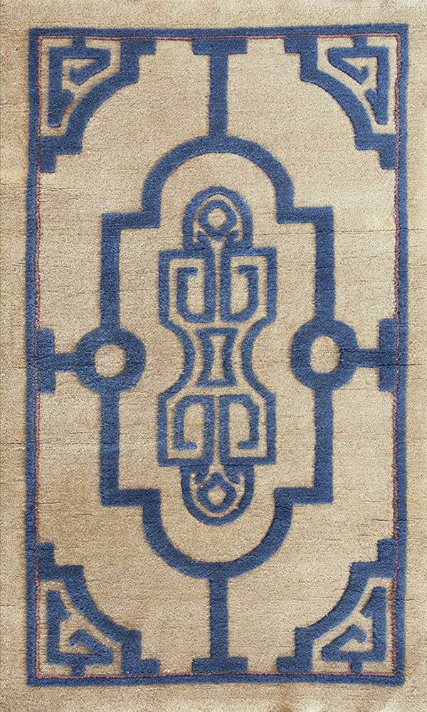 This textured rug displays a detailed blue interlocking geometric design against a tan background.