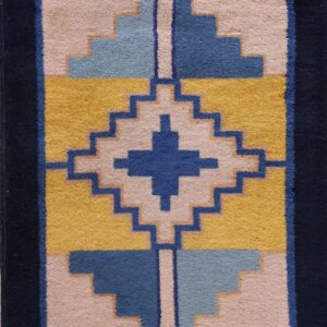 Geometric rug with dark blue borders and stepped designs in gold, light blue, medium blue, and pale pink.
