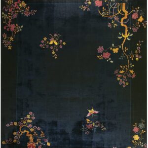 A velvety dark blue rug featuring stylized gold and pink floral branches in the corners.