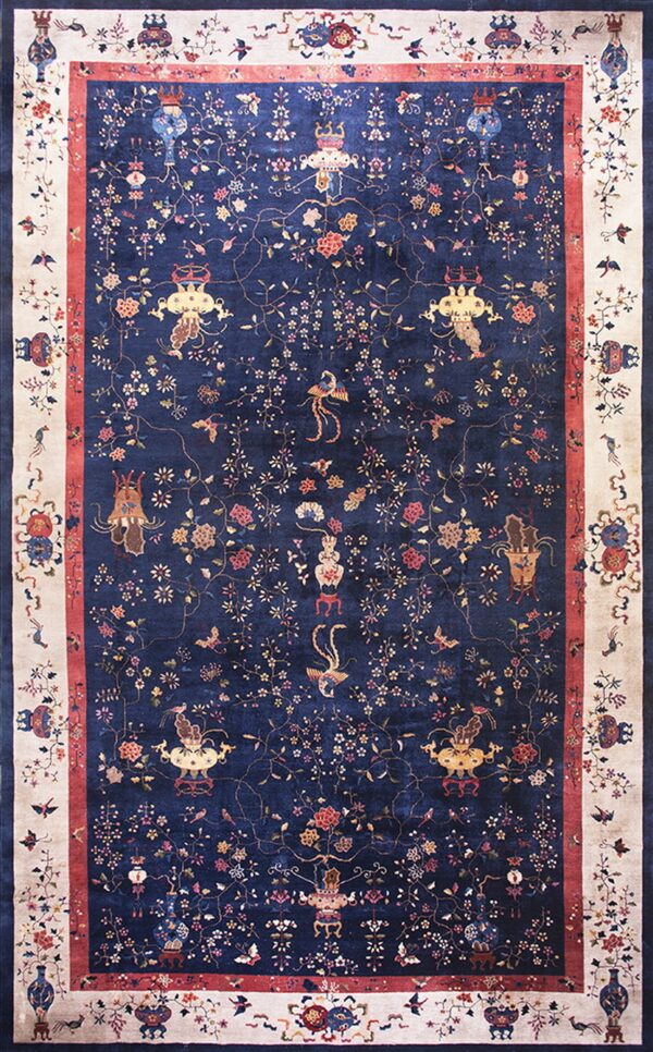Detailed navy rug with multicolor flowering vines, birds, and vases, framed by an ivory border.