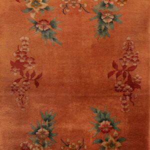 Floral design on peach background rug