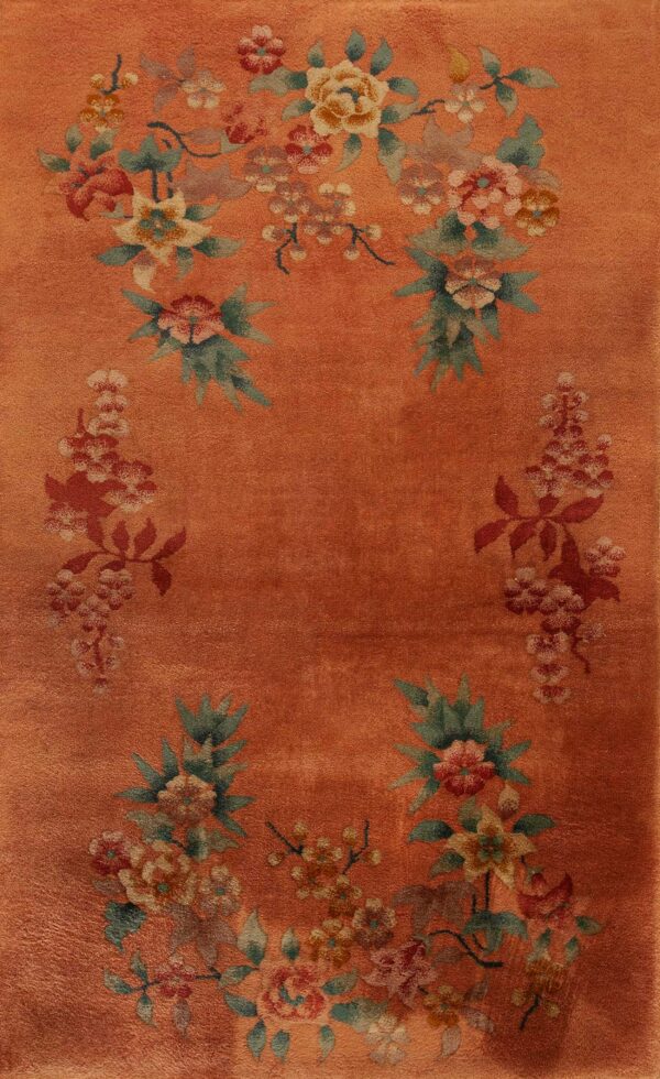 Floral design on peach background rug
