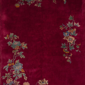 Floral design on deep red background.