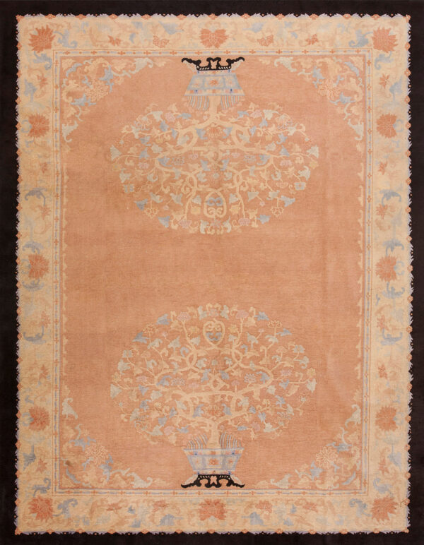 Low-pile rug with a peach field, pale blue accents, and two central floral vase medallions.