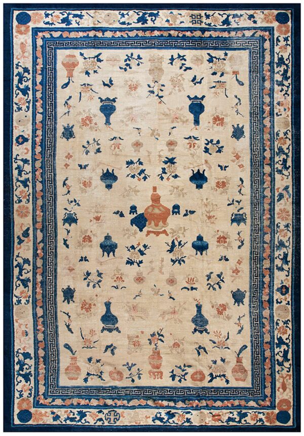 Cream rug featuring scattered blue and rust vase and floral patterns with dense blue borders.