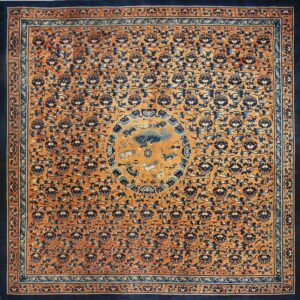 Navy and orange square rug with dense floral motifs and a detailed central medallion featuring mythical animals.