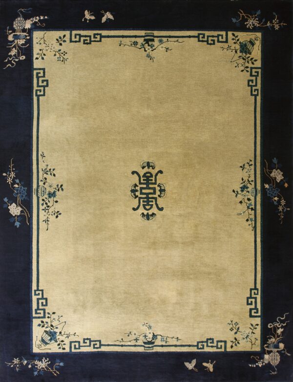 Rectangular rug with a gold field, navy border, and stylized blue geometric and floral patterns.