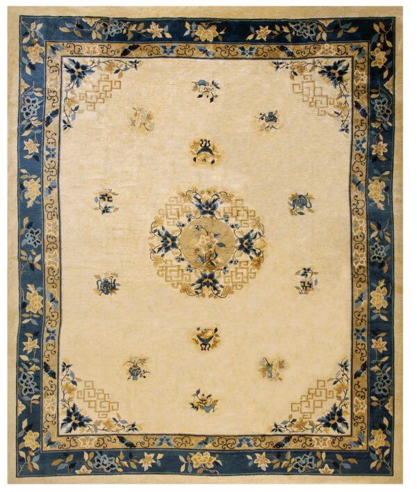 Beige rug featuring a deep blue floral border, golden geometric corner details, and a central round medallion.