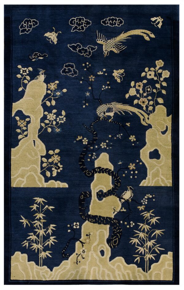 Navy blue rug with a light gold scenic design of birds, rocks, bamboo, flowers, and floating clouds.