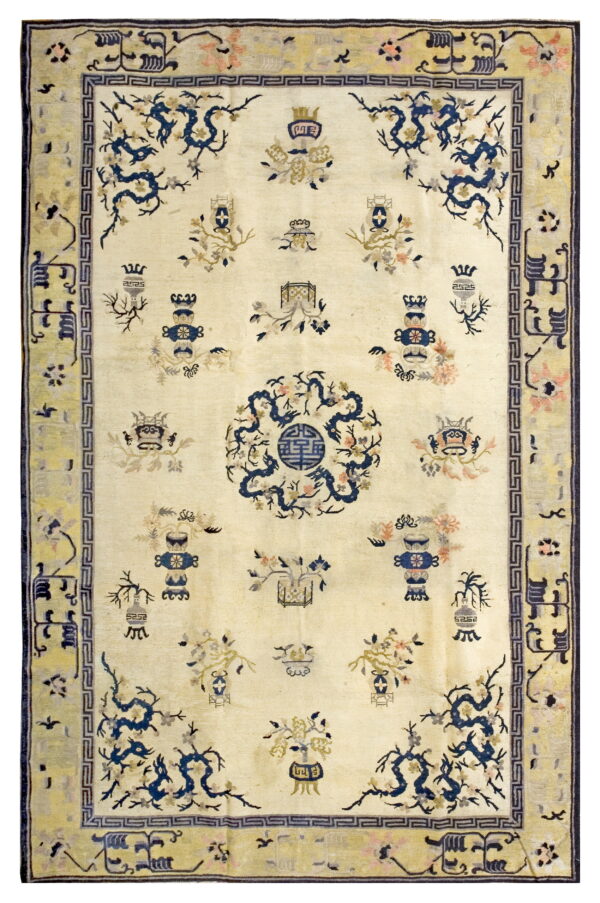 Ivory low pile rug featuring navy blue dragon and floral motifs within a pale yellow patterned border.