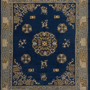 Navy blue rug with intricate patterns