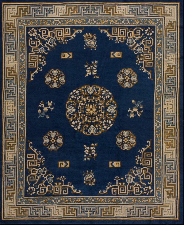 Navy blue rug with intricate patterns