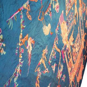 Crinkled deep teal textile embroidered with intricate orange and pink avian and floral designs.