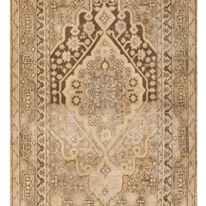 Faded tan rug featuring a traditional dark brown central medallion and complex geometric borders.