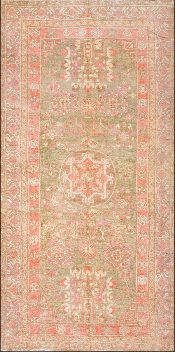 Muted olive green runner rug featuring a central medallion and ornate borders in distressed coral and tan.