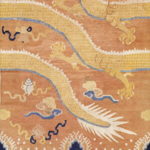 Terracotta rug with a golden yellow dragon design, detailed blue clouds, and patterned lower border.