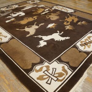 Square brown rug with stylized tan and cream flying animal designs over distressed hardwood.