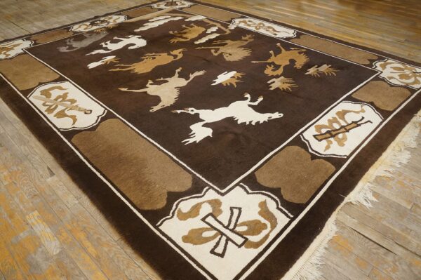 Square brown rug with stylized tan and cream flying animal designs over distressed hardwood.