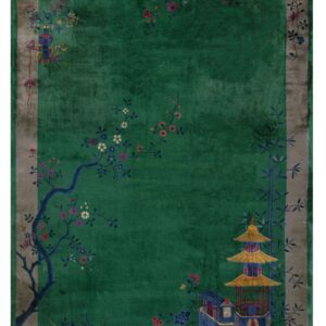 Plush green rug with a taupe border and colorful accents depicting a pagoda and flowering tree.