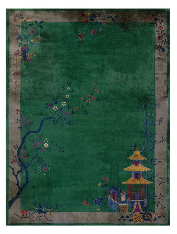 Plush green rug with a taupe border and colorful accents depicting a pagoda and flowering tree.