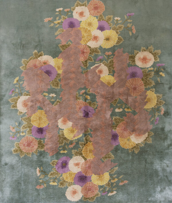 Low-pile teal rug with a large arrangement of multicolored flowers and stylized reddish-brown foliage.