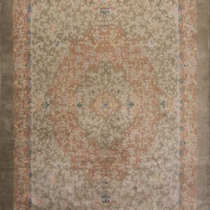 Low-pile rug with muted coral, beige, and taupe scrolling floral patterns and a dark gray outer border.