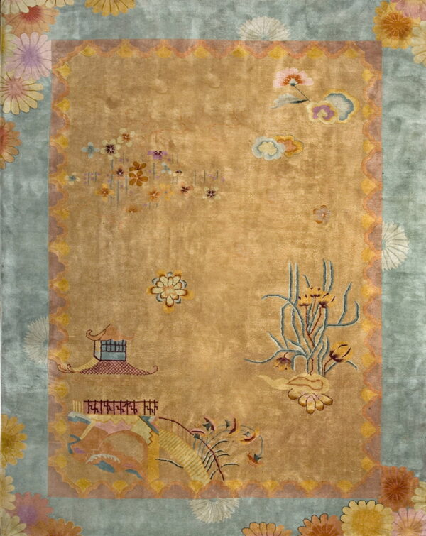 Golden-yellow high-pile rug featuring a blue border and scattered floral and architectural designs.